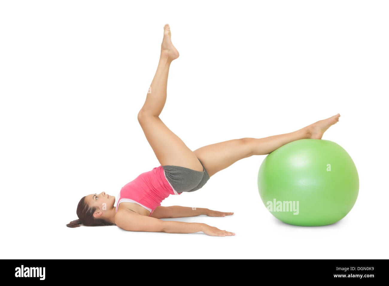 Attractive sporty brunette exercising with exercise ball Stock Photo