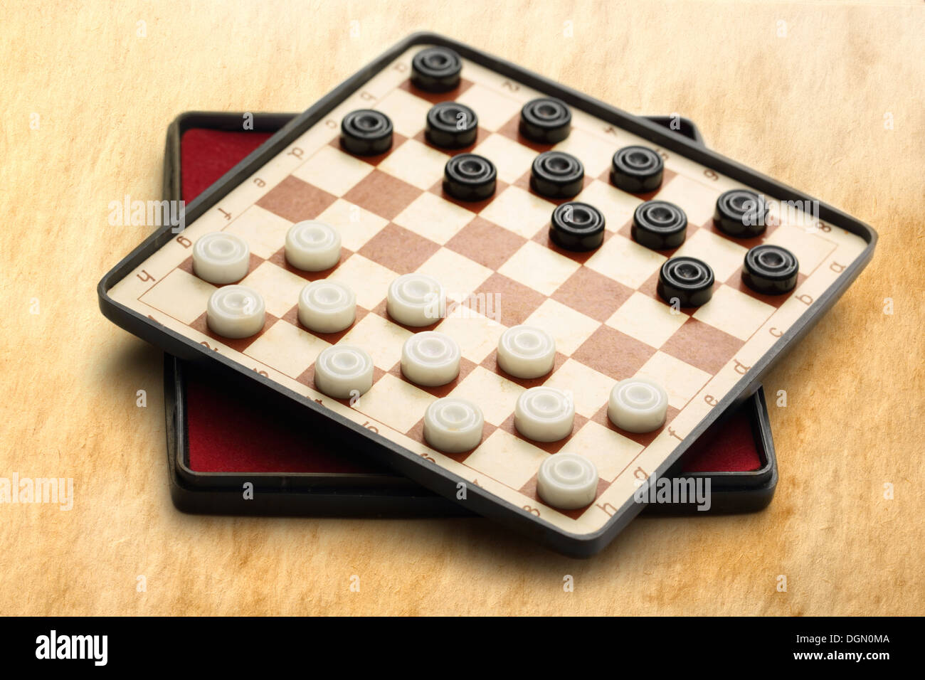 Travelling draughts on aged background Stock Photo