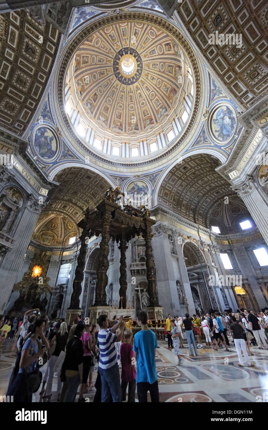 Vatican City, Vatican City, St. Peter's Basilica at tourists in Bernini's bronze canopy Stock Photo