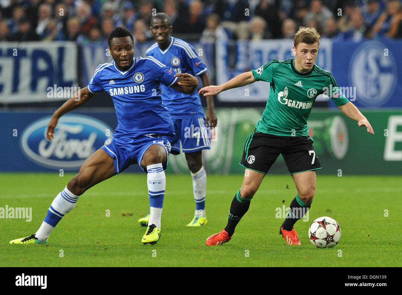 Gelsenkirchen, Germany. 22nd Oct, 2013. Schalke's Max Meyer (R) vies for the ball with Chelsea's John Obi Mikel during the Champions League group E soccer match between FC Schalke 04 and FC Chelsea London at the Gelsenkirchen stadium in Gelsenkirchen, Germany, 22 October 2013. Photo: Frederic Scheidemann/dpa/Alamy Live News Stock Photo