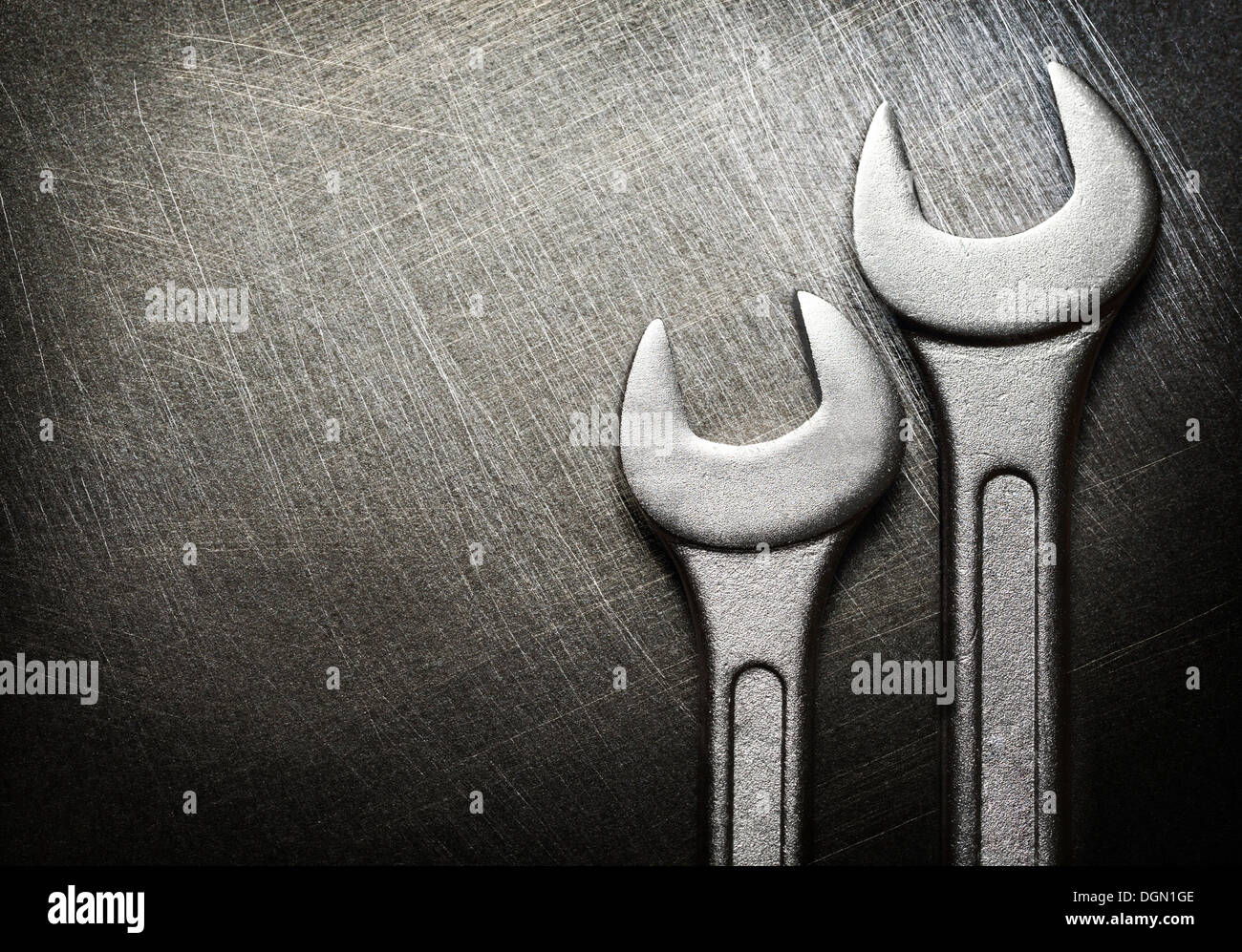 Spanner on steel scratchy background Stock Photo