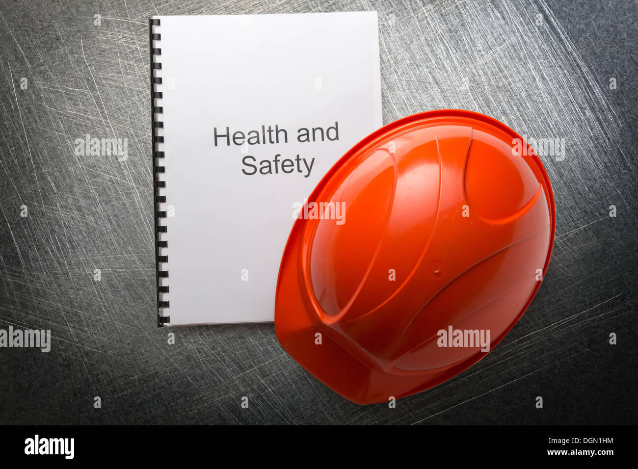 Health and safety register with helmet Stock Photo