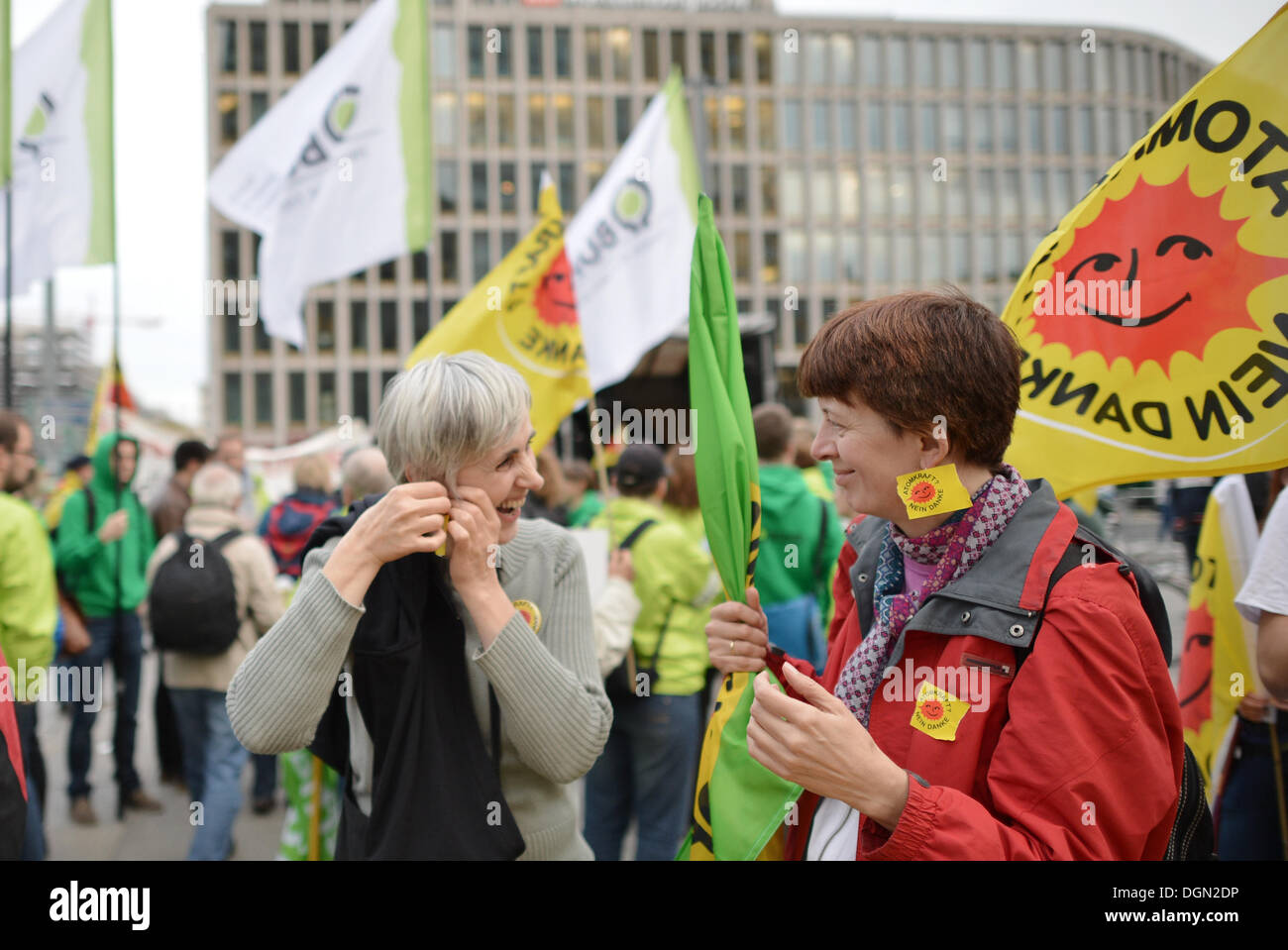 Berlin, Germany. 23rd Oct, 2013. Demonstrants protest for the development of newable energies on occasion of the coalition talks between CDU/CSU and SPD in Berlin, Germany, 23 October 2013. The NGO BUND and others called for the rally under the motto 'Warming up for the protest for sun and wind, against coal and nuclear power'. Photo: Bernd von Jutrczenka/dpa/Alamy Live News Stock Photo