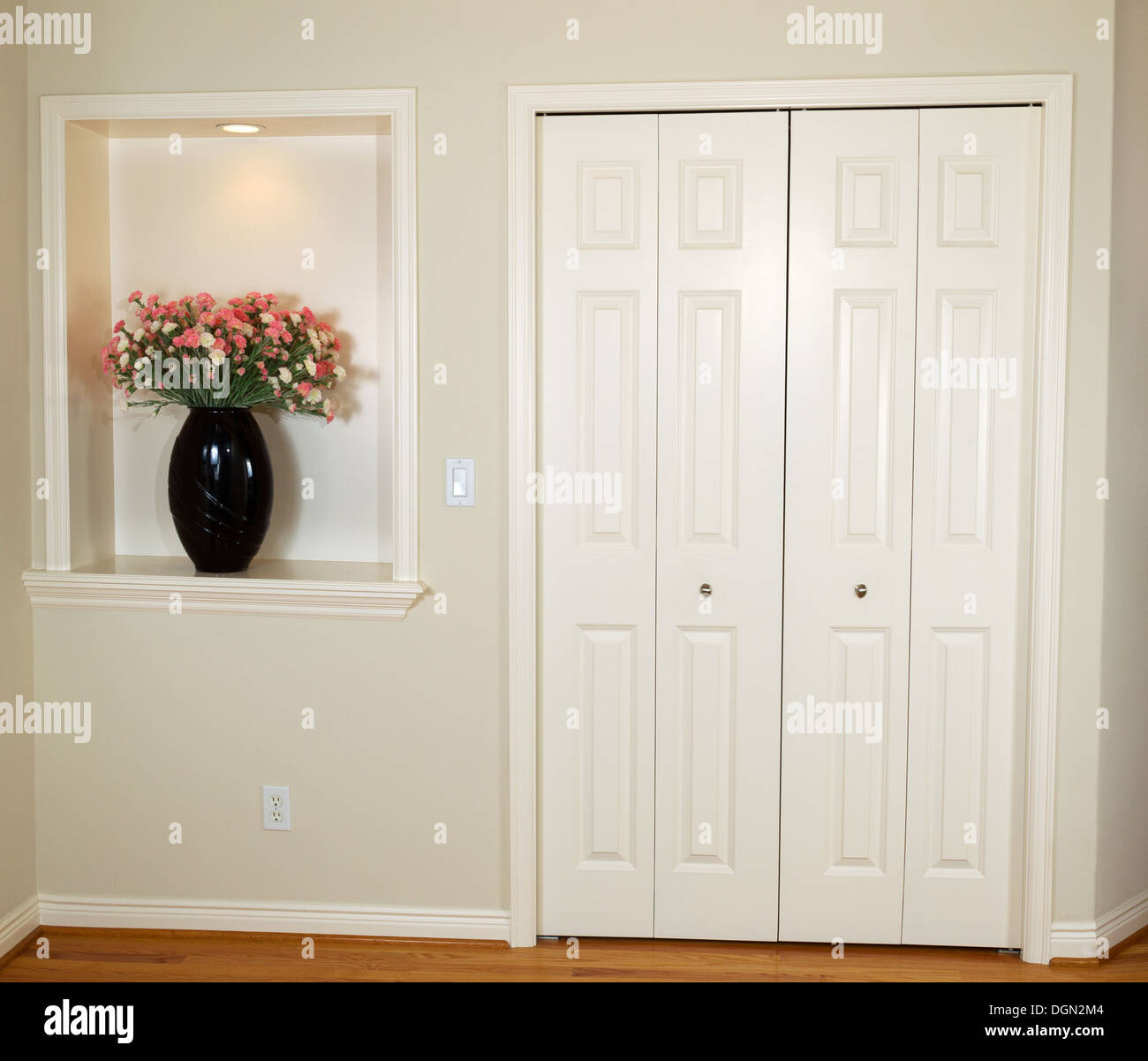 Interior photo of front closet and wall with decorated flower and light Stock Photo