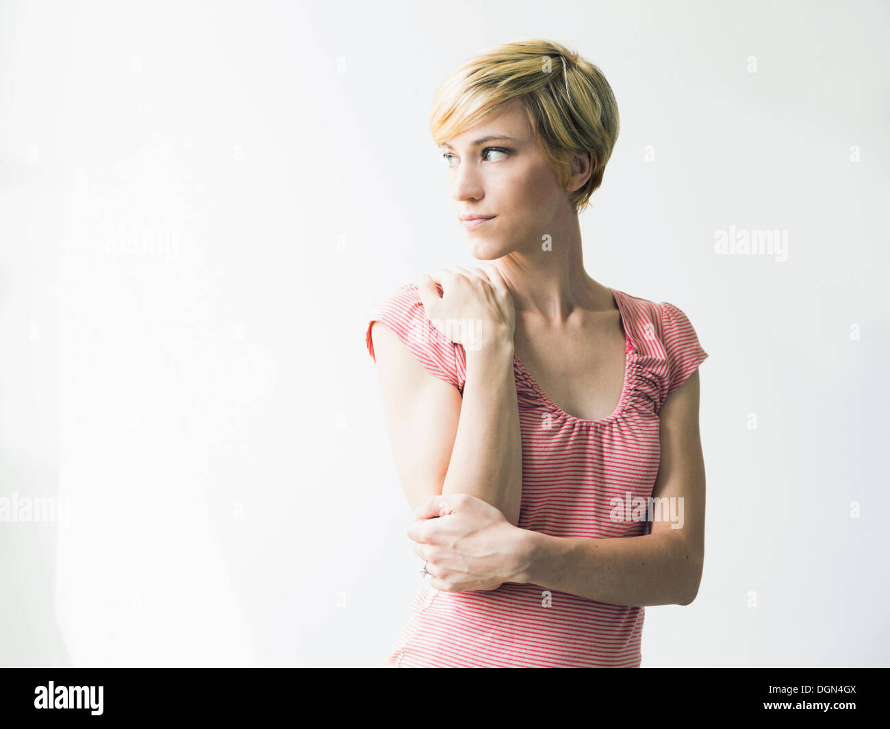Young woman looking away, studio shot Stock Photo
