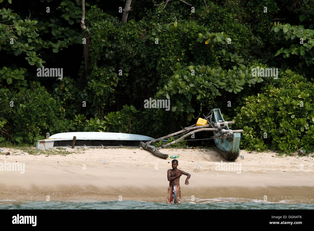 LOCAL ON JUNGLE BEACH & BOAT UNAWATUNA SRI LANKA ASIA 18 March 2013 Stock Photo