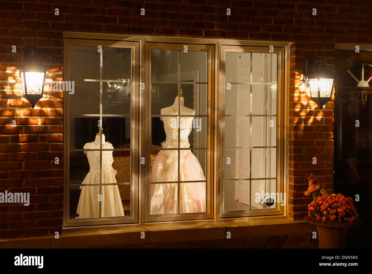 Dress shop window at night in historic Kleinburg Ontario Stock Photo
