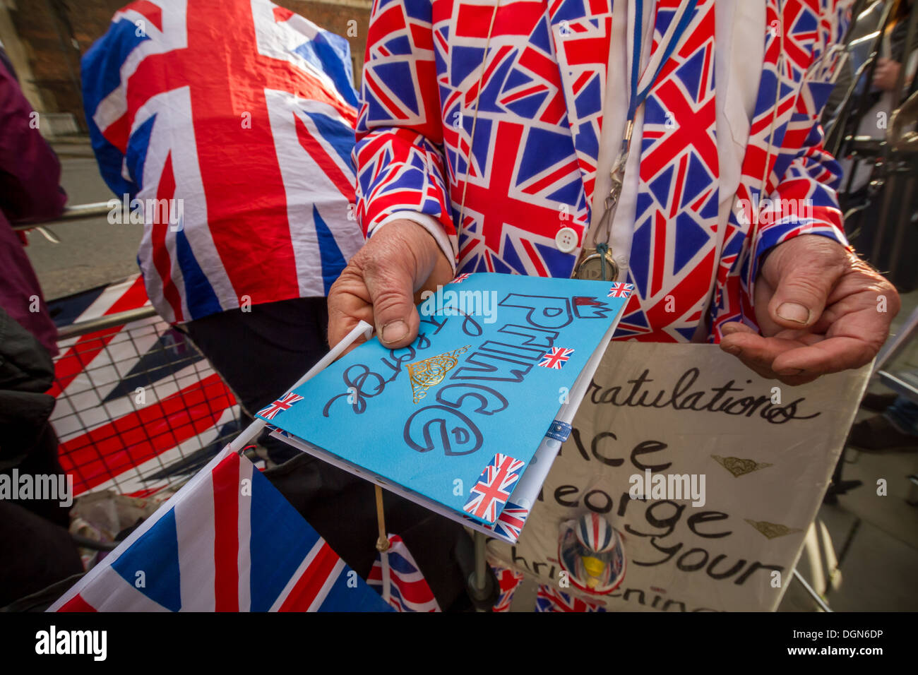 Royal fans and press wait outside the gates of St James's Palace as baby Prince George is Christened. London, UK. Stock Photo