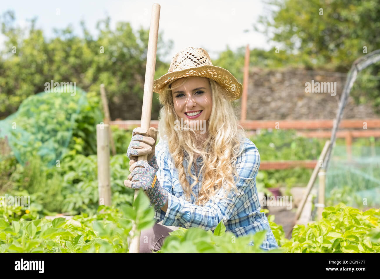 Blonde woman wearing a straw hat Stock Photo