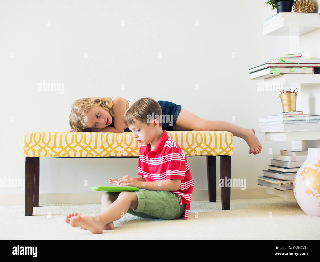Kids (4-5, 6-7) using digital tablet indoors Stock Photo