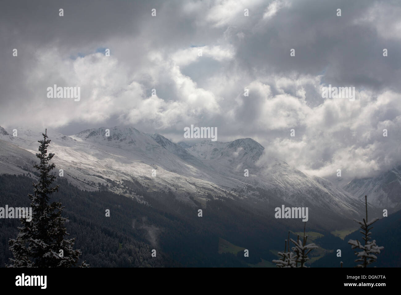 Storm clouds passing over The Tallihorn & Gfroren Horn  above The Sertig Tal Landwasser Valley Davos Graubunden Switzerland Stock Photo