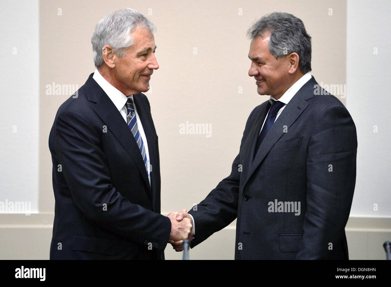 US Secretary of Defense Chuck Hagel shakes hands with Russian Minister of Defense Sergei Shoygu after a meeting of the non-NATO International Security Assistance Force at NATO headquarters October 23, 2013 in Brussels, Belgium. Stock Photo