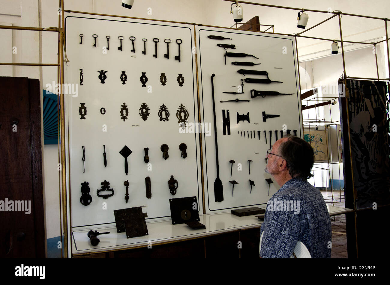 Museo de Arquitectura, man looks at a display of door fixtures and fittings of the 18th and 19th century, buildings built in 173 Stock Photo