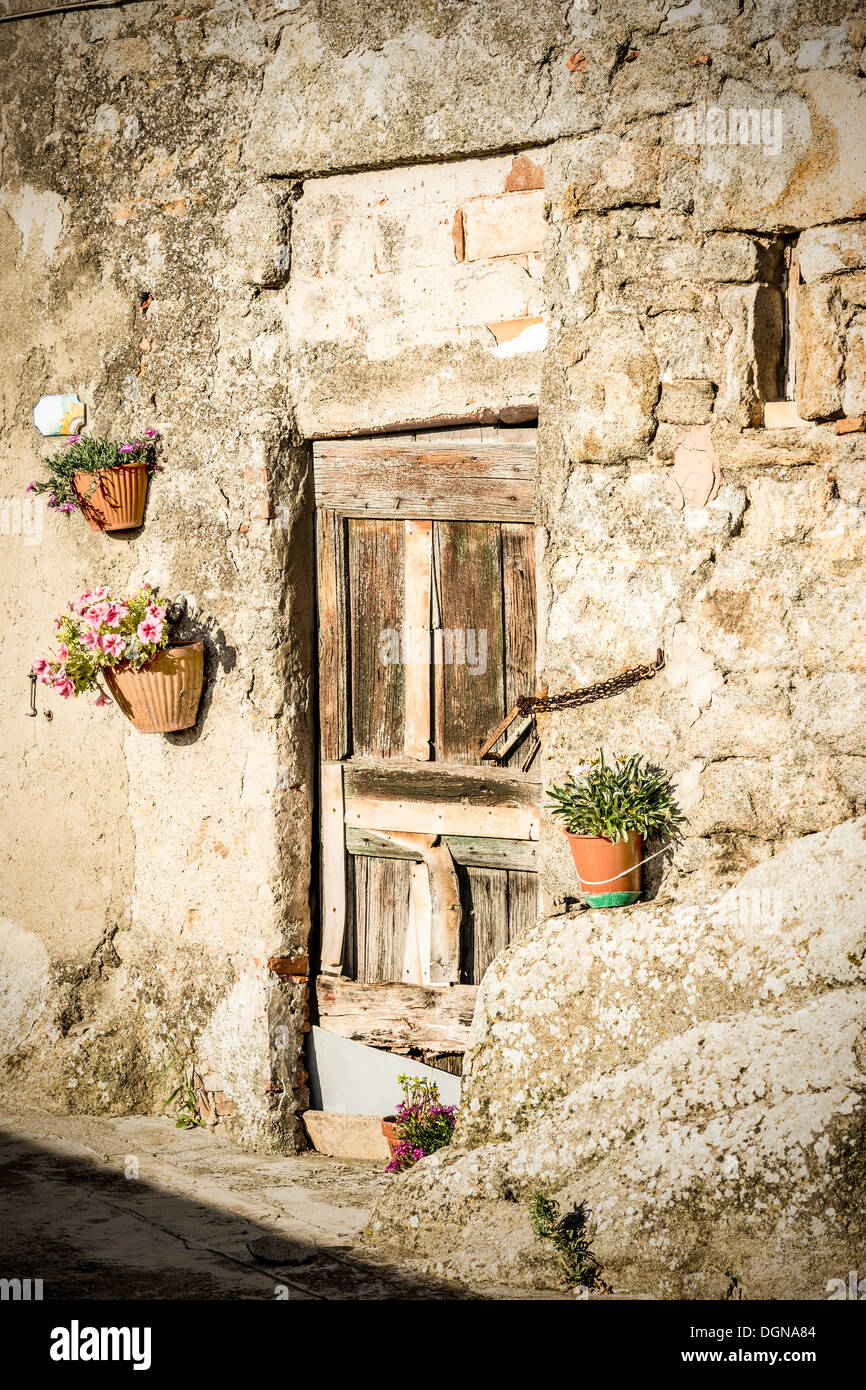 Wooden door of italian stone house hi-res stock photography and images