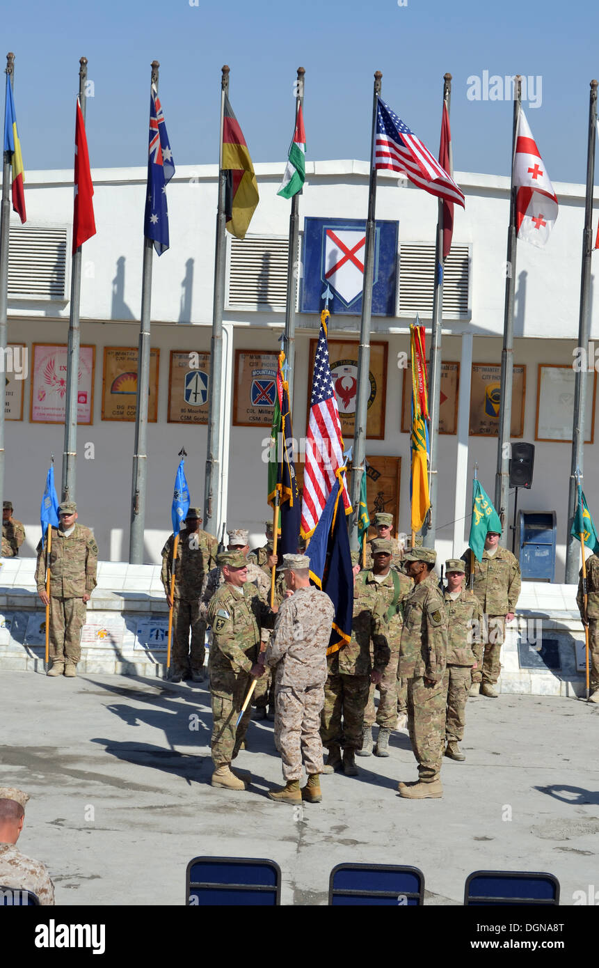 Commander, International Security Assistance Force Gen. Joseph F. Dunford Jr. passes the flag to U.S. Army Brig. Gen. Mark S. Inch during the transfer of authority ceremony Oct. 17 at Camp Phoenix, Afghanistan, signifying the assumption of command. Team m Stock Photo