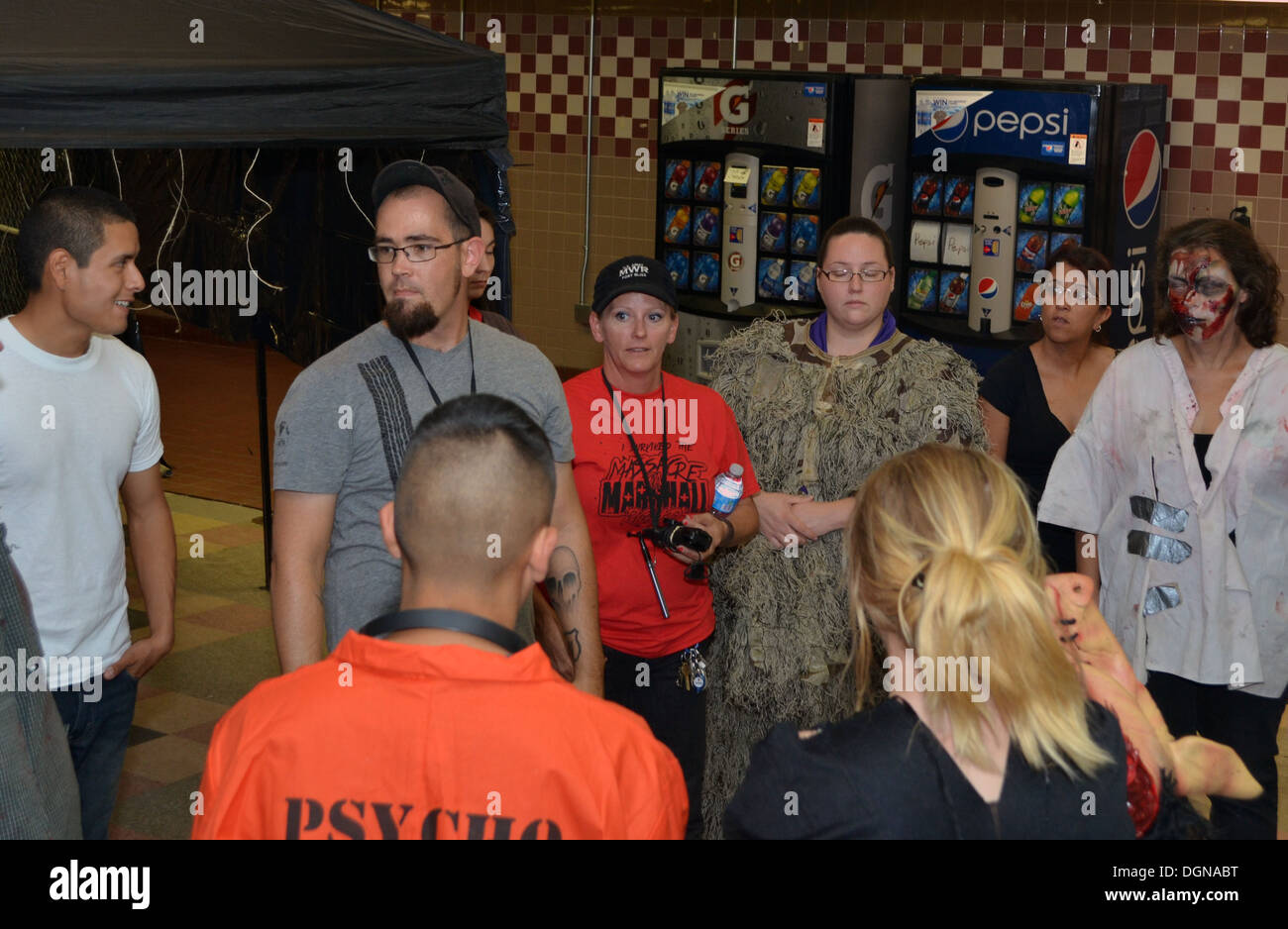 Chris Bohn, a MWR special events team coordinator, briefs volunteers prior to the opening of the Massacre on Marshall Rd. Wednesday, on Fort Bliss, Texas. Bohn was the mastermind behind the Massacre on Marshall Rd. Haunted House. Stock Photo