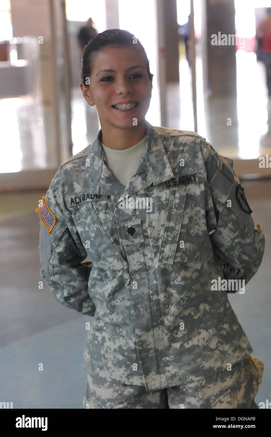 Spc. Michelle Alvarado, a member of the 1st Mission Support Command, U.S. Army Reserve-Puerto Rico, waits at the Luis Muñoz Marin airport while other soldiers get ready to depart. Alvarado and other soldiers departed the Caribbean island Oct. 18 on their Stock Photo