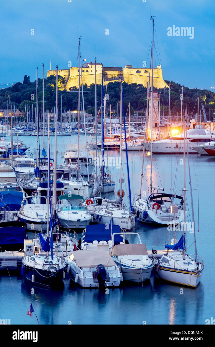 Europe, France, Alpes-Maritimes, Antibes. Marina and Fort Carre at Twilight. Stock Photo