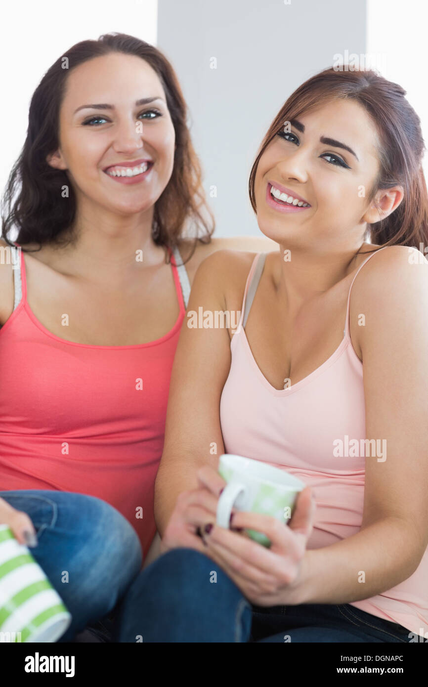 Two pretty young women smiling at the camera Stock Photo