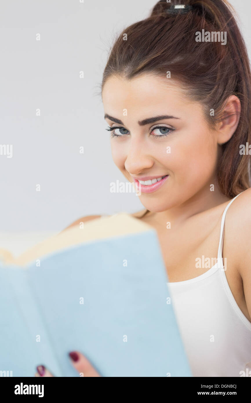 Beautiful woman holding a book Stock Photo