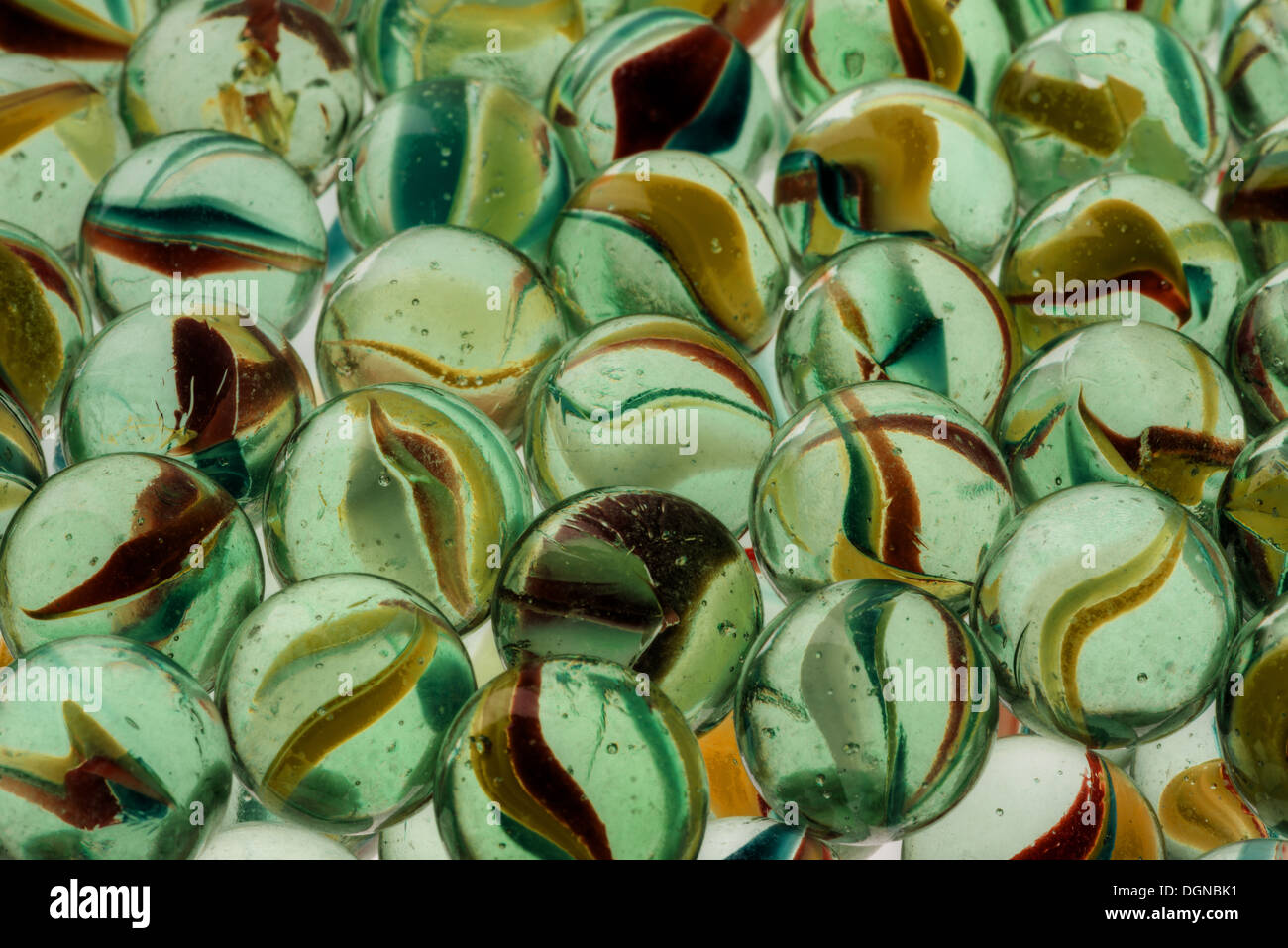 collection of old glass transparent marbles with unique swirls of