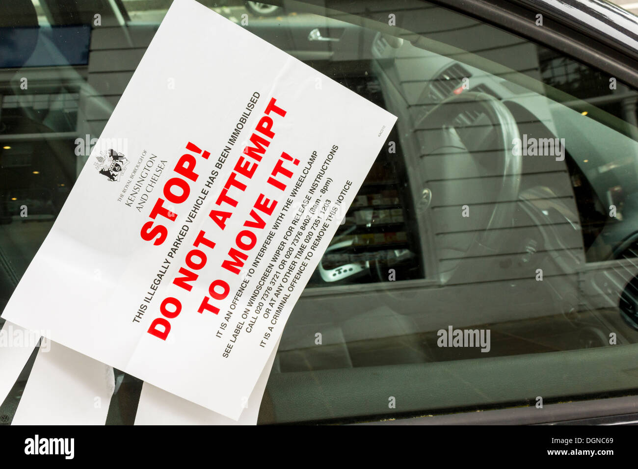 Wheel Clamp Notice on Car Window in London (Royal Borough of Kensington and Chelsea), UK Stock Photo