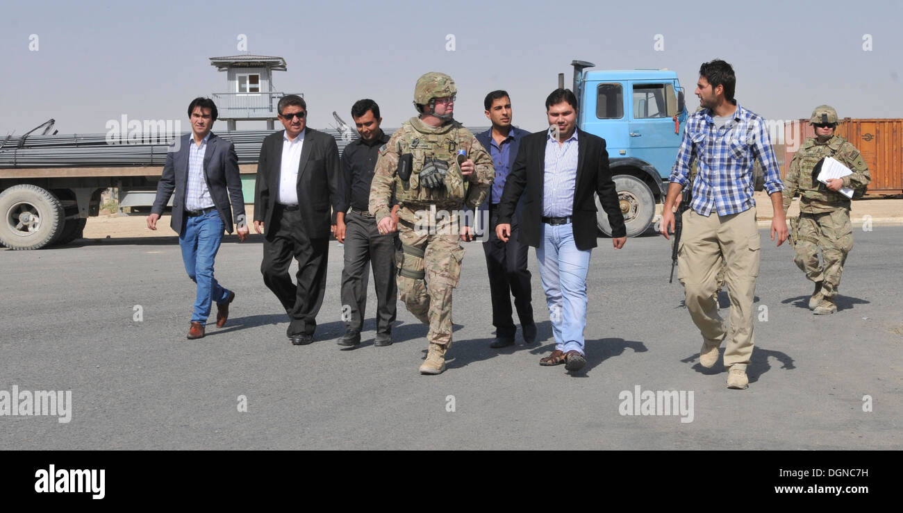 Members of the key leader delegation of Afghanistan Ministry of Customs and Industry, along with 1st Theater Sustainment Command, Afghan Rail Advisory Team discuss ways to improve rail Port 4. Stock Photo