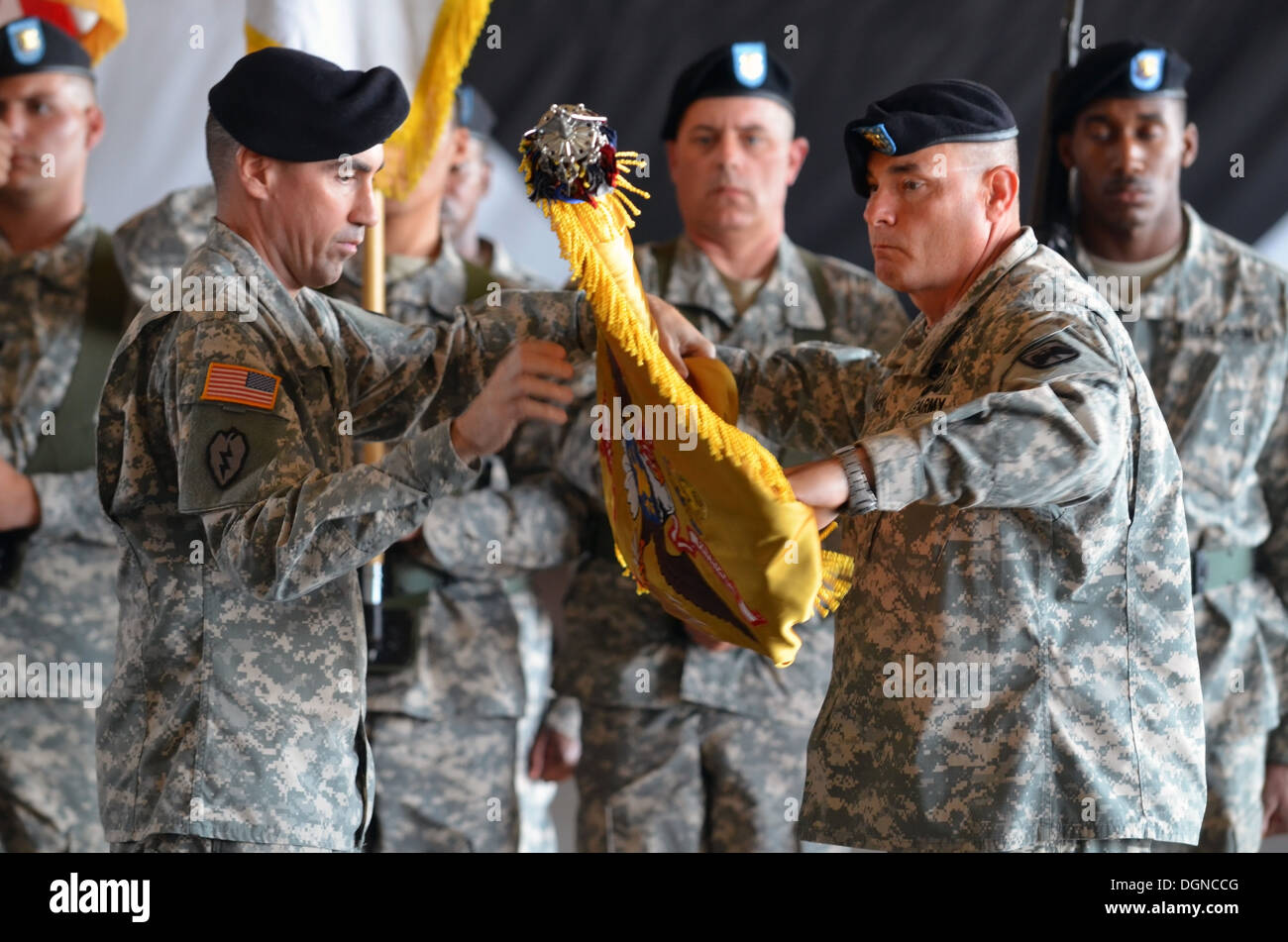 The commander of 4th Attack Reconnaissance Squadron, 6th Cavalry Regiment, Lt. Col. Brian Watkins, and the senior enlisted advisor to the commander, Command Sgt. Maj. Stanley Williams, uncase the unit's colors Oct. 18, 2013 at Camp Humphreys. Stock Photo