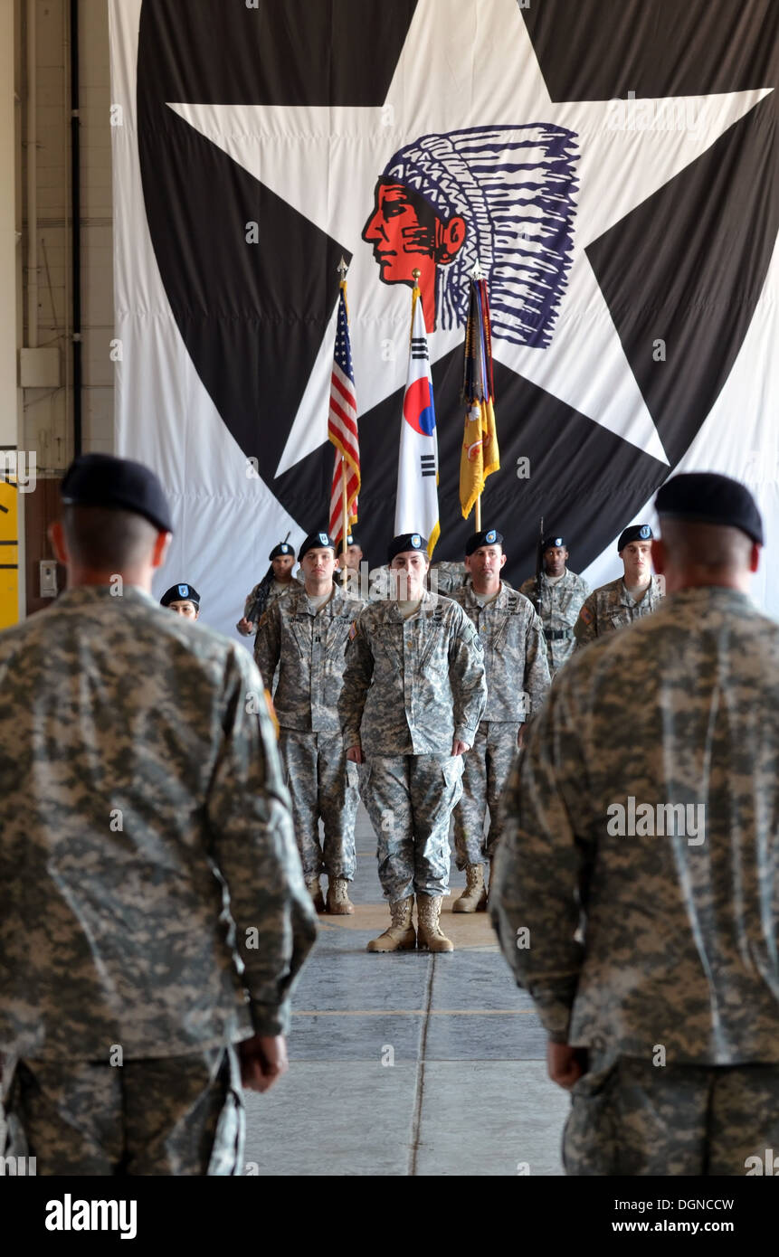 The commander of 4th Attack Reconnaissance Squadron, 6th Cavalry Regiment, Lt. Col. Brian Watkins, and the senior enlisted advisor to the commander, Command Sgt. Maj. Stanley Williams, waits for the unit colors to be retired after the uncasing ceremony Oc Stock Photo