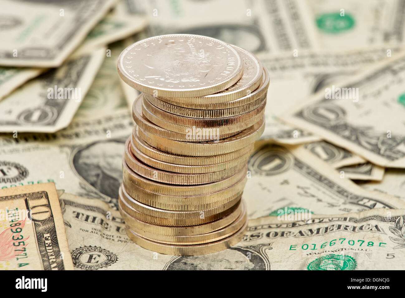 Silver Coins Stacked Up On Top Of A Pile Of Money Stock Photo 61936520