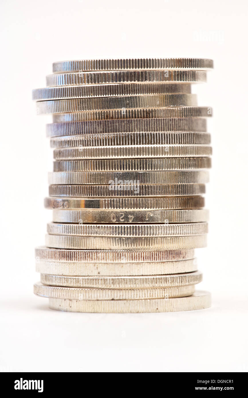 Stack of silver coins on white background Stock Photo - Alamy