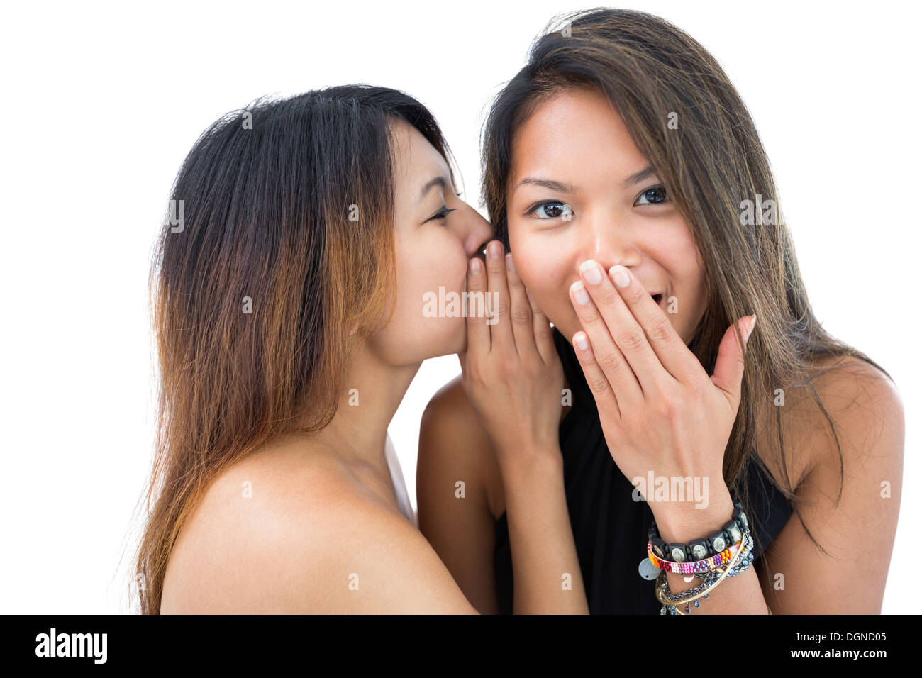 Pretty woman telling something to her sister Stock Photo