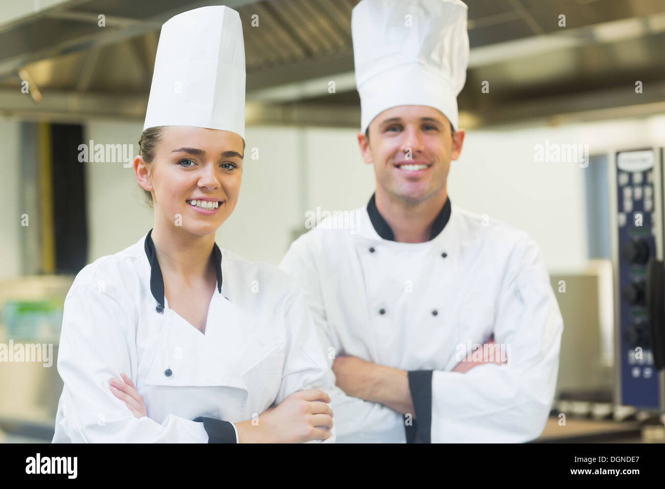 Two chefs smiling at the camera Stock Photo