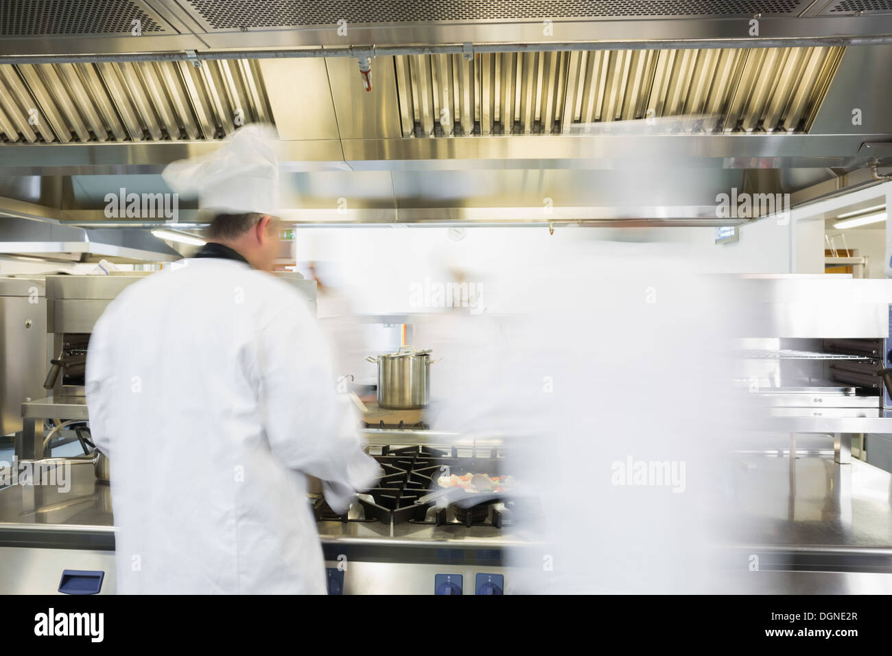 Chefs working in a kitchen Stock Photo