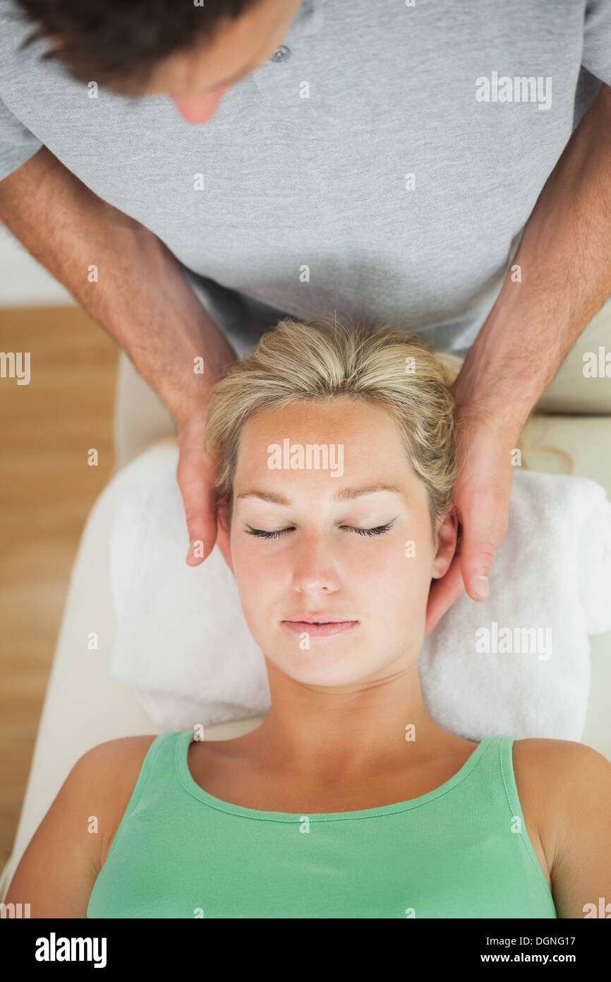 Physiotherapist massaging the head of a patient Stock Photo Alamy