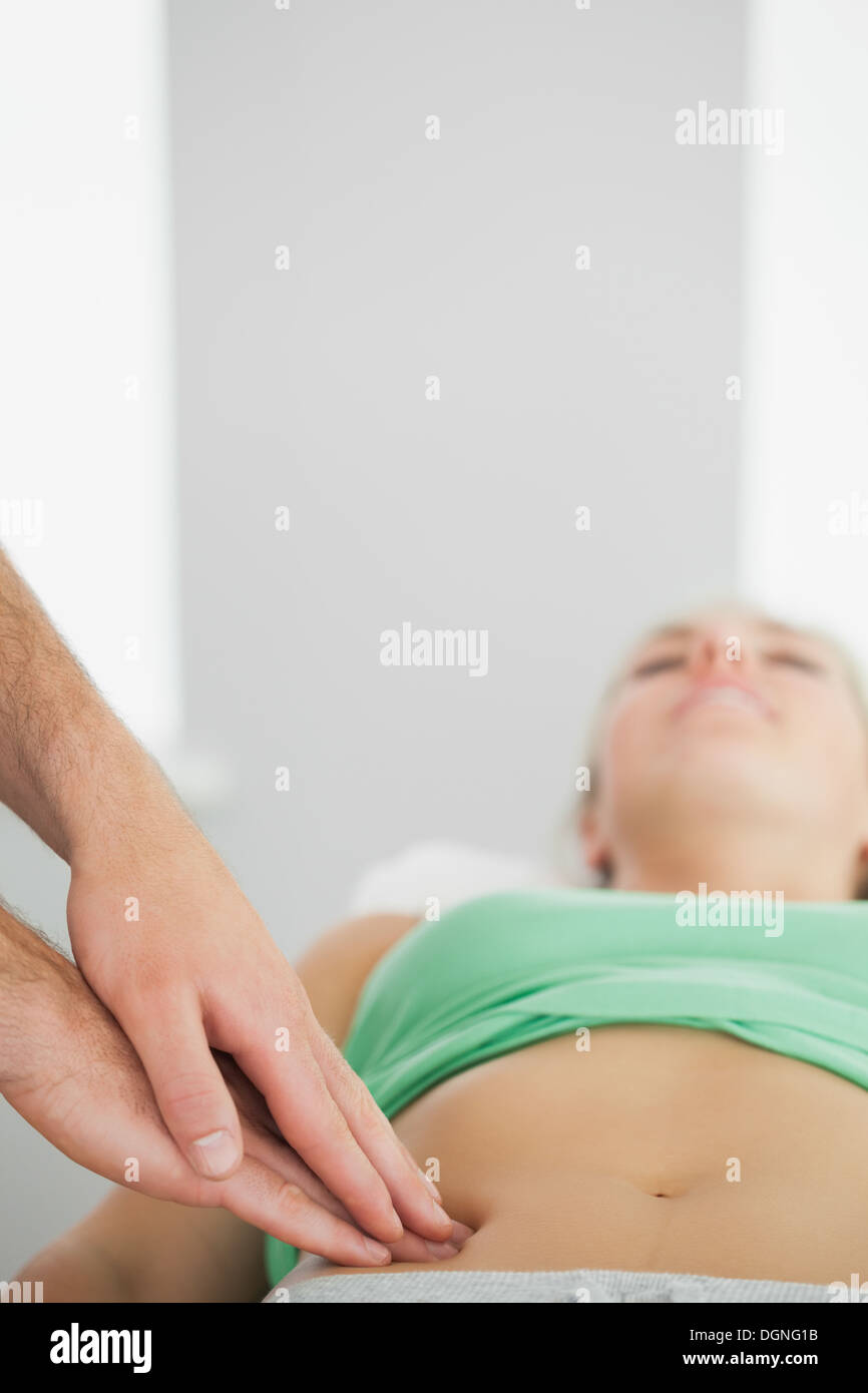 Physiotherapist checking patients pelvis Stock Photo
