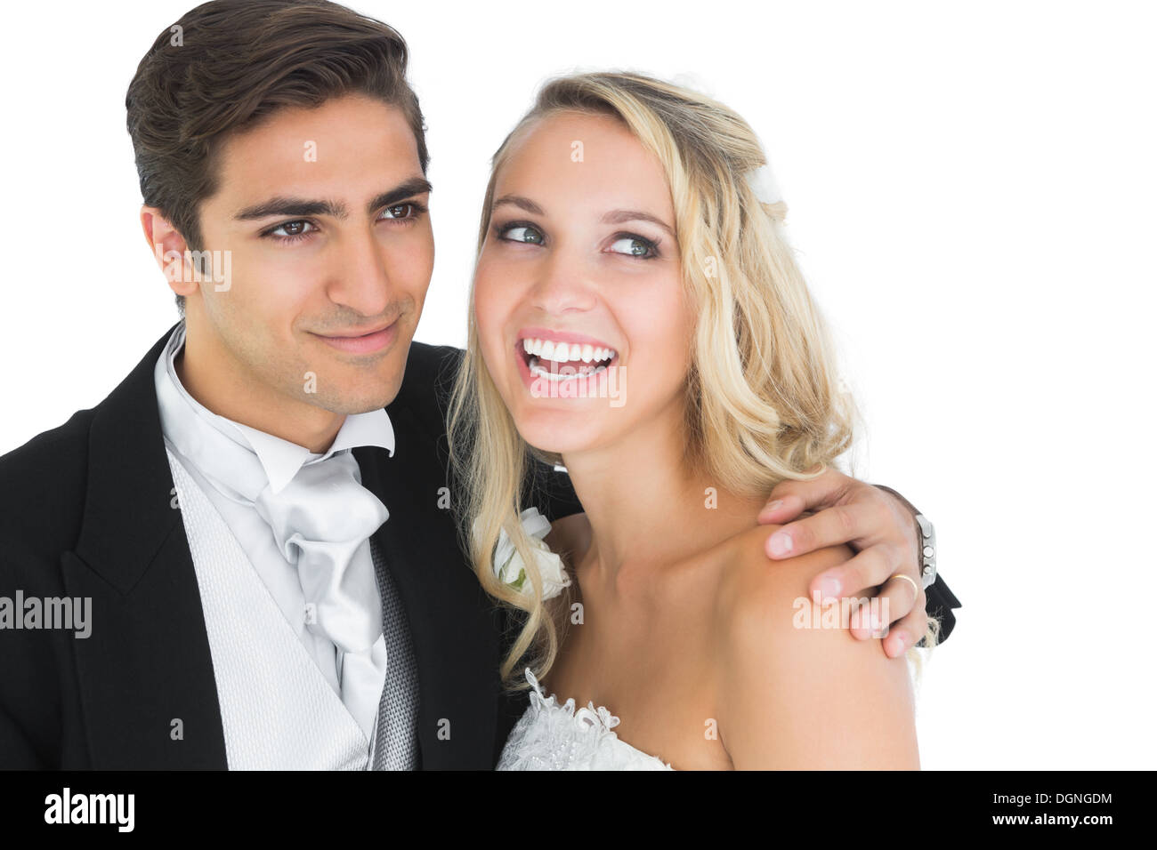 Smiling handsome bridegroom posing with his wife Stock Photo