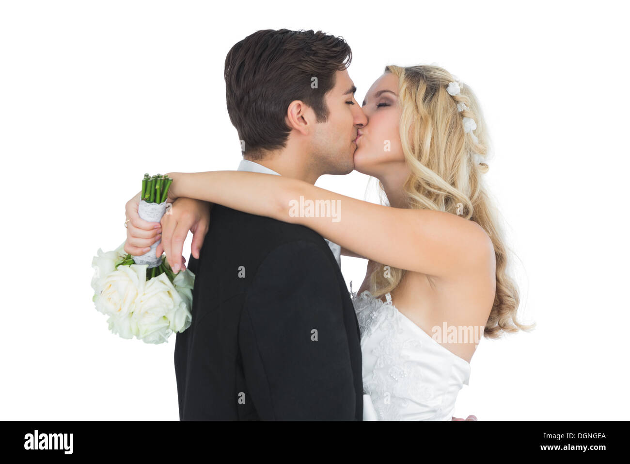 Happy attractive married couple posing kissing each other Stock Photo
