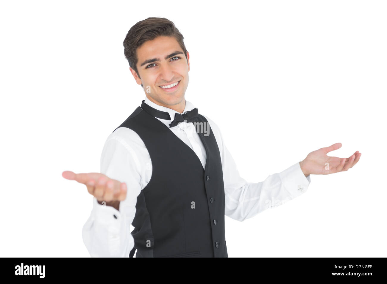 Handsome young waiter making a certain gesture Stock Photo