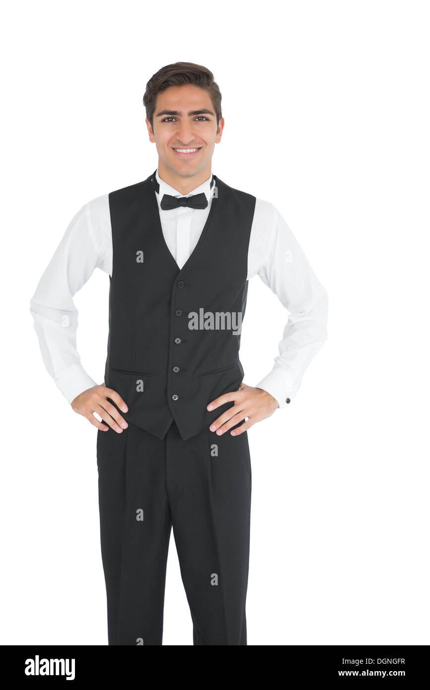 Attractive young waiter posing smiling at camera Stock Photo