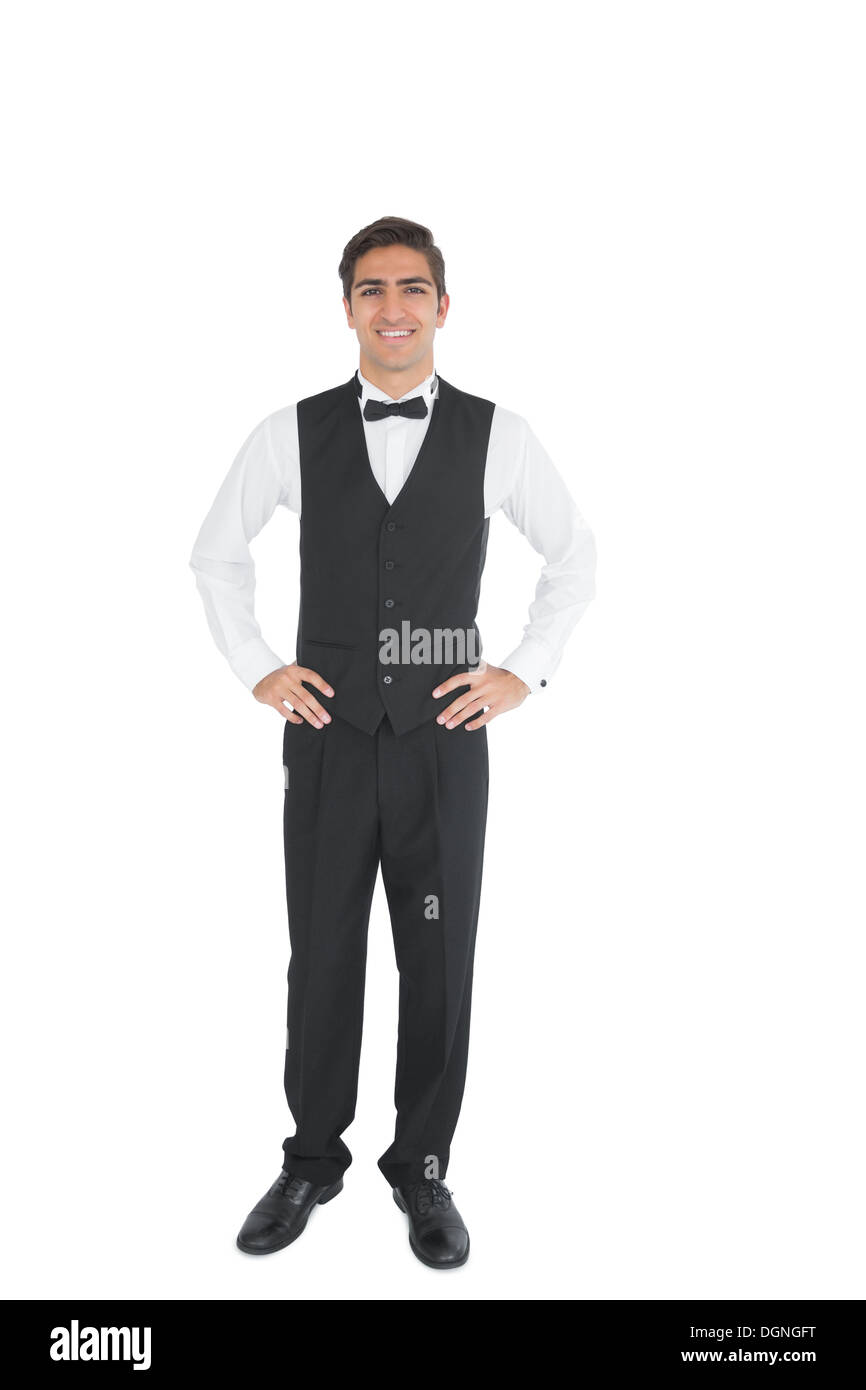 Attractive waiter posing with hands on hips Stock Photo