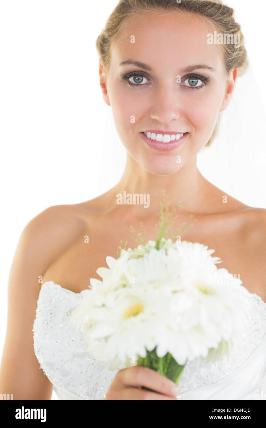 Gorgeous blonde bride posing holding a bouquet Stock Photo