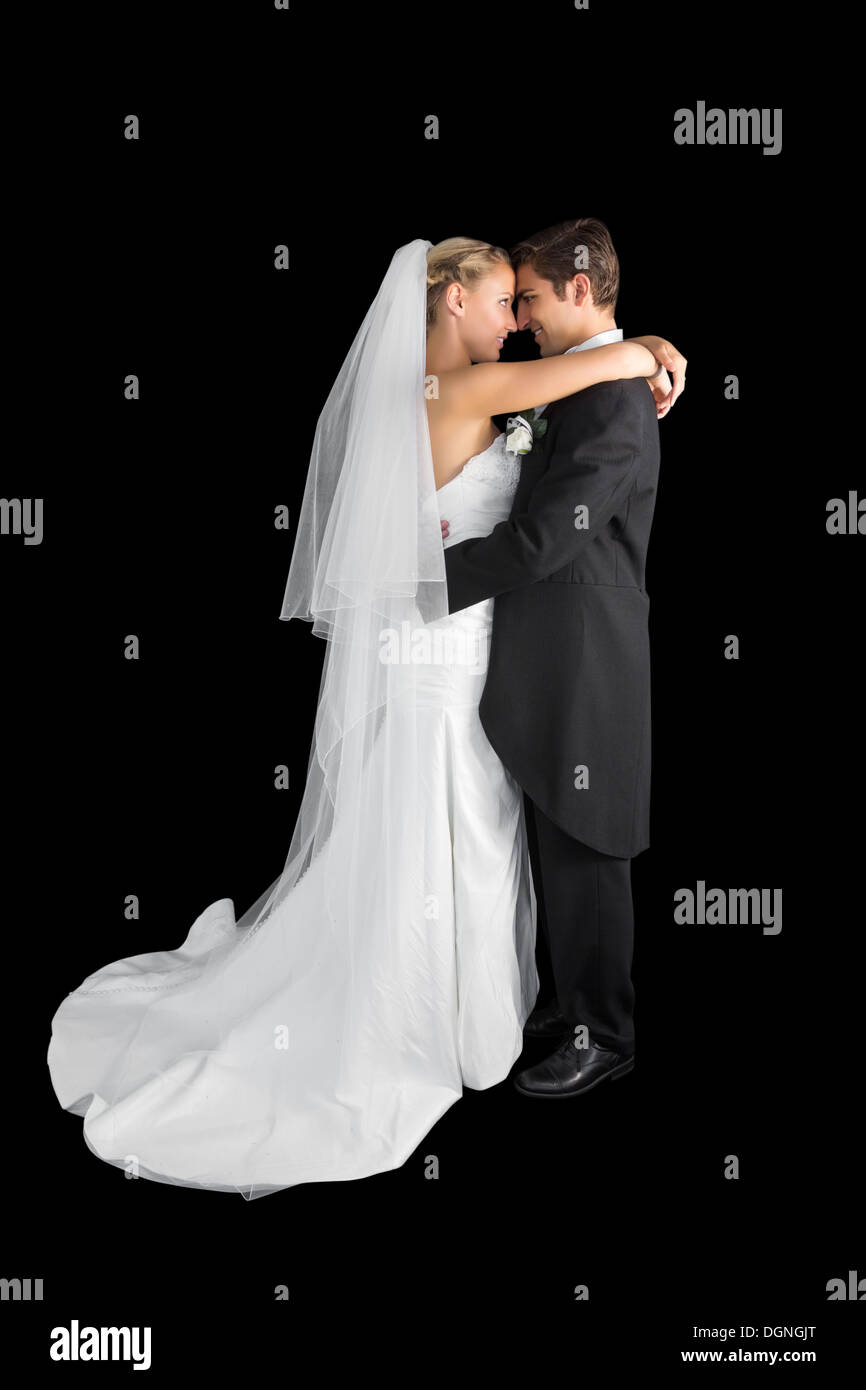 Sweet young couple posing hugging each other Stock Photo