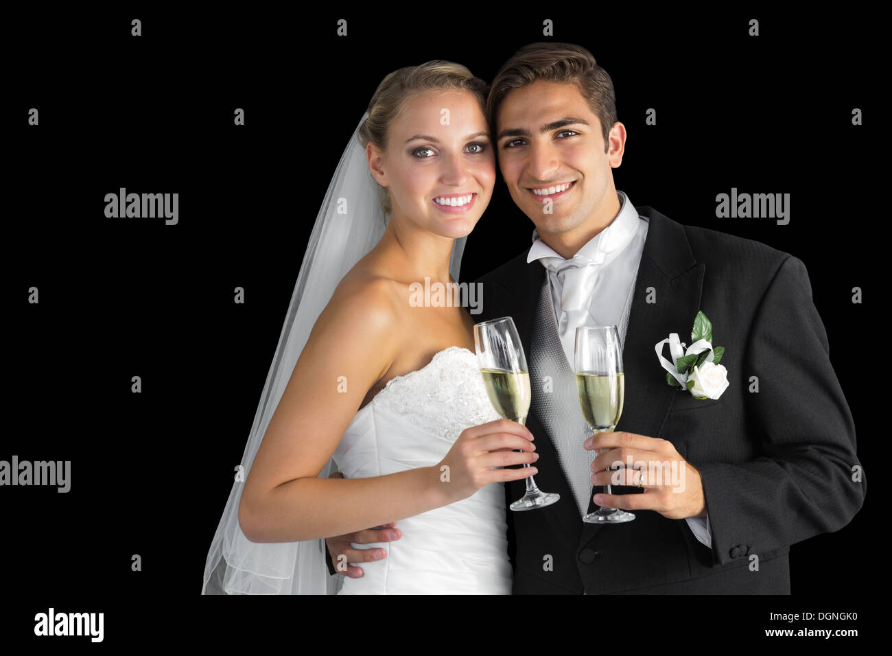 Sweet young couple posing with champagne glasses Stock Photo
