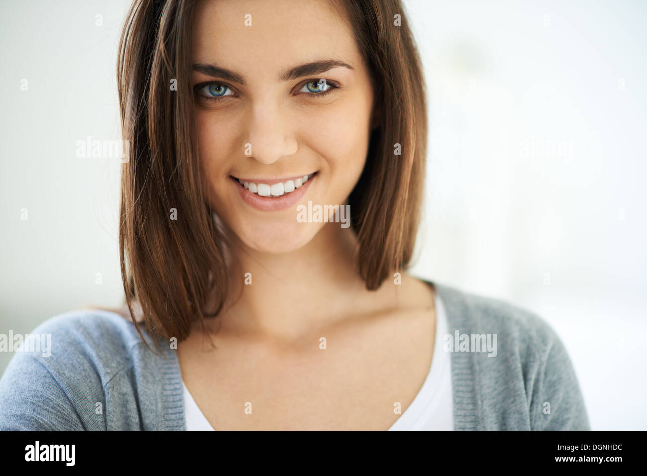 Happy young woman looking at camera with smile Stock Photo - Alamy