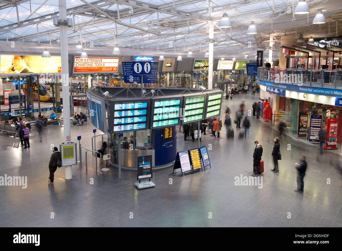 The inside foyer of Manchester Piccadilly railway train station during the evening. Stock Photo