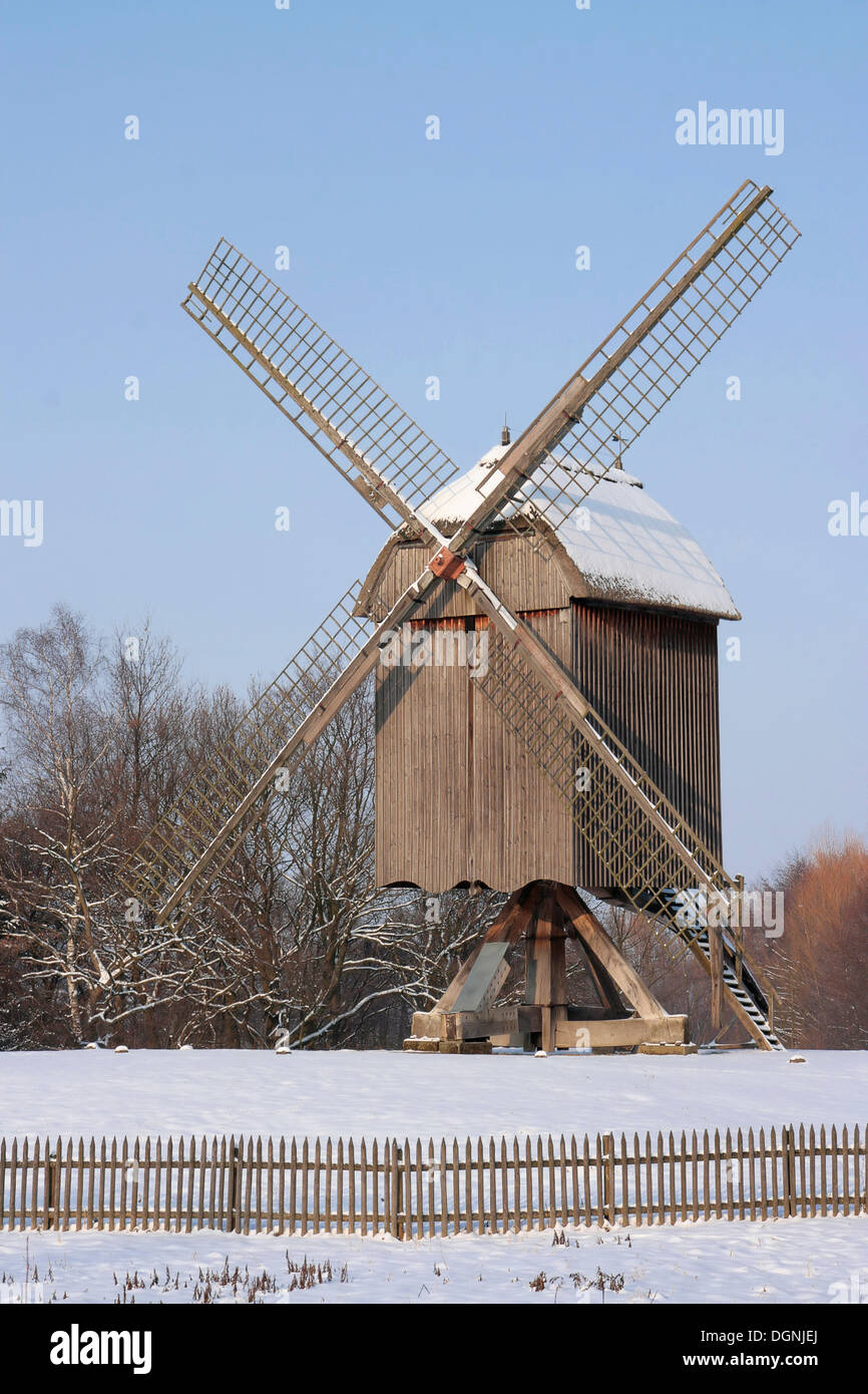 Historic post mill in snow, winter in Hessenpark, Neu-Anspach, Taunus, Hesse Stock Photo