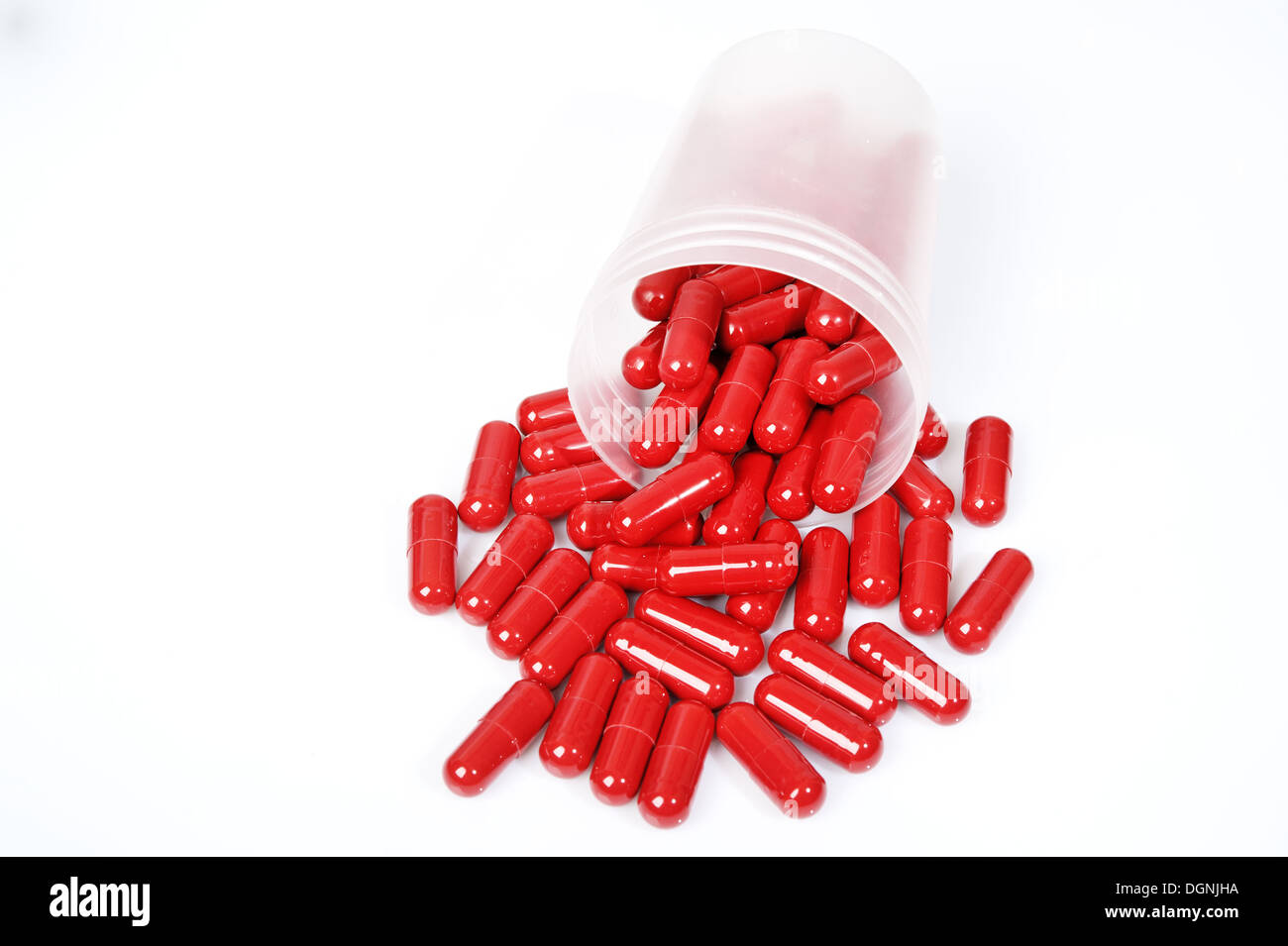 Red capsules, vitamin Stock Photo - Alamy