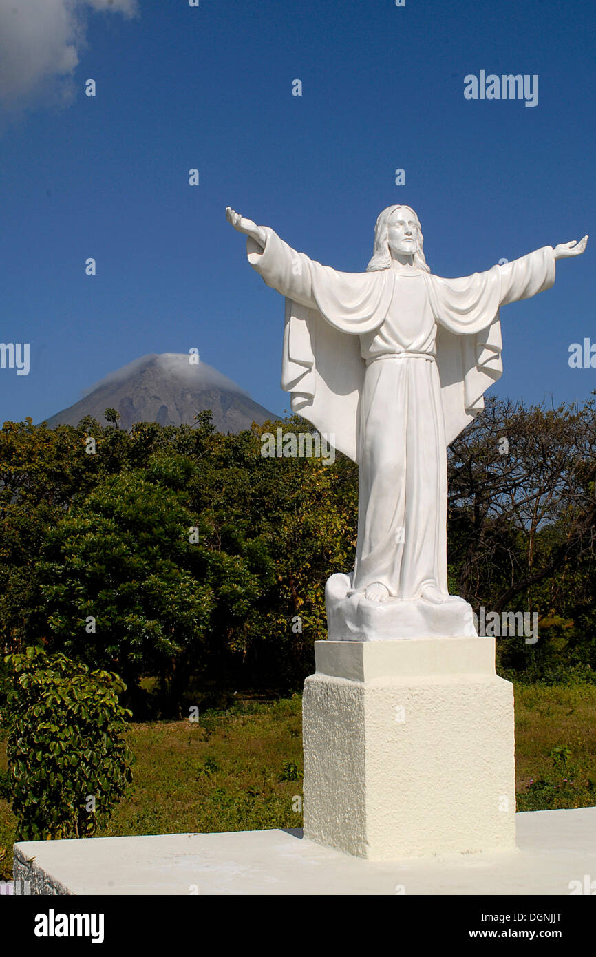Jesus statue in front of volcano Mt. Concepcion, Isla de Ometepe
