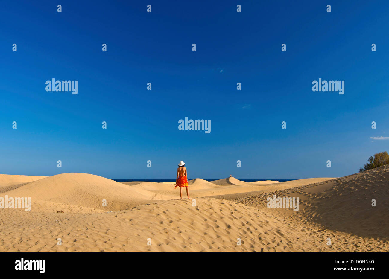 Woman in front of sand dunes of Maspalomas, Gran Canaria, Canary Islands, Spain Stock Photo